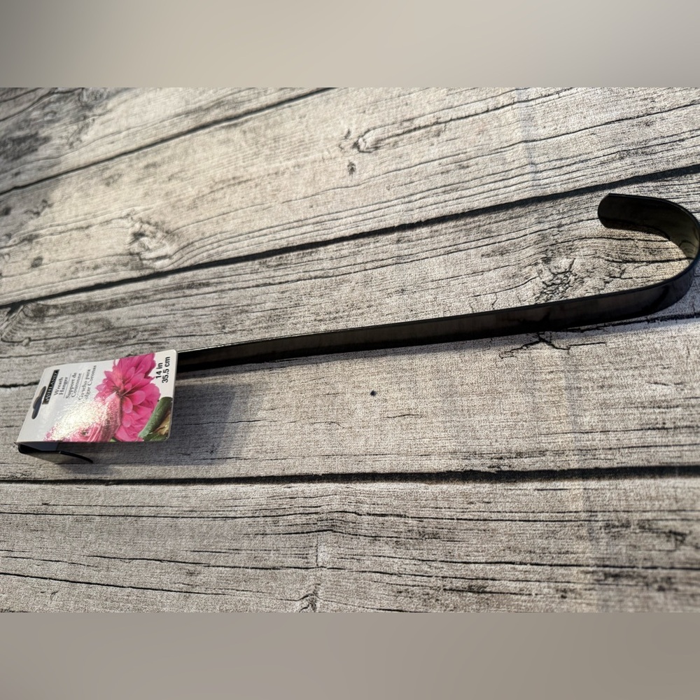 NWT. Metal wreath door hanger. New with tag, black color, useful all year!